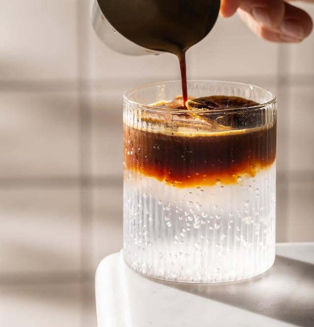 Espresso Tonic - refreshing coffee drink with sparkling water served in textured glass